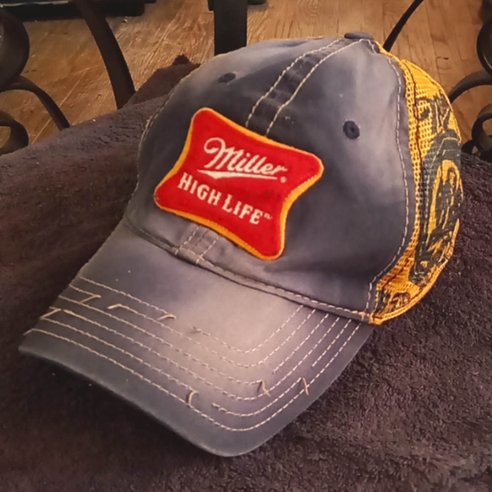 Vintage Miller High Life hat tht has been worn in just right